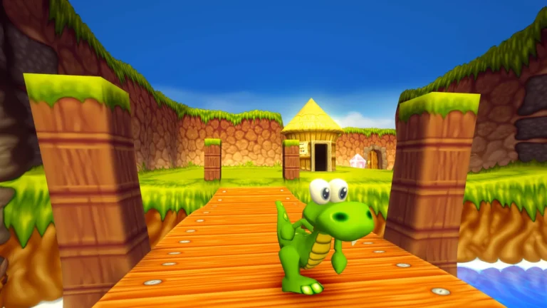 Croc sur un chemin en bois dans le remaster de Croc 2: Kingdom of the Gobbos