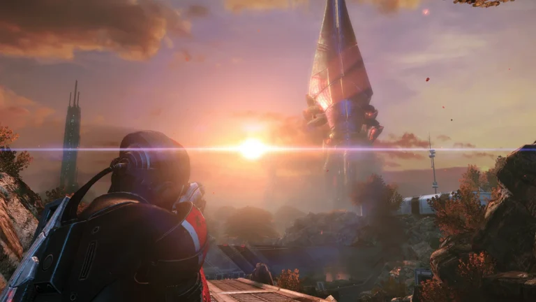 Shepard dans Mass Effect Édition Légendaire, face à un Moissonneur au coucher du soleil