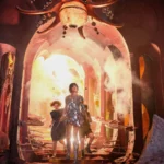 Narnia : Le Neveu du magicien, deux enfants dans un atelier encombré éclairé par une lumière dorée