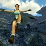 Lara Croft en plein saut de l'ange au-dessus de rochers, dans la version remasterisée du premier Tomb Raider