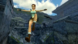 Lara Croft en plein saut de l'ange au-dessus de rochers, dans la version remasterisée du premier Tomb Raider