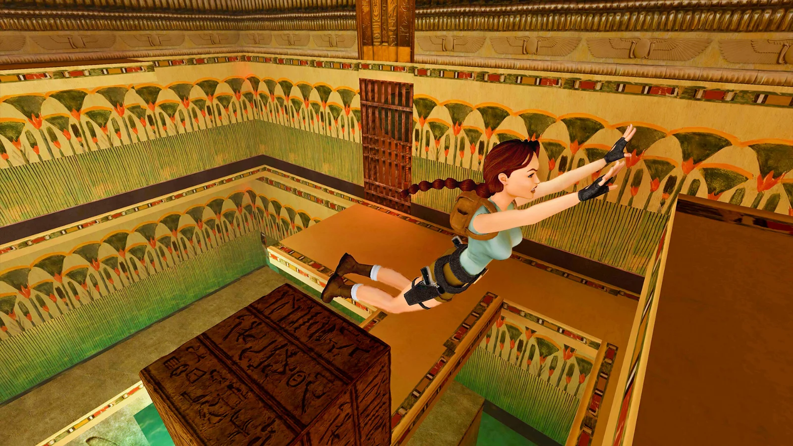 Lara Croft saute entre des blocs dans un tombeau égyptien du premier Tomb Raider, en version remasterisée